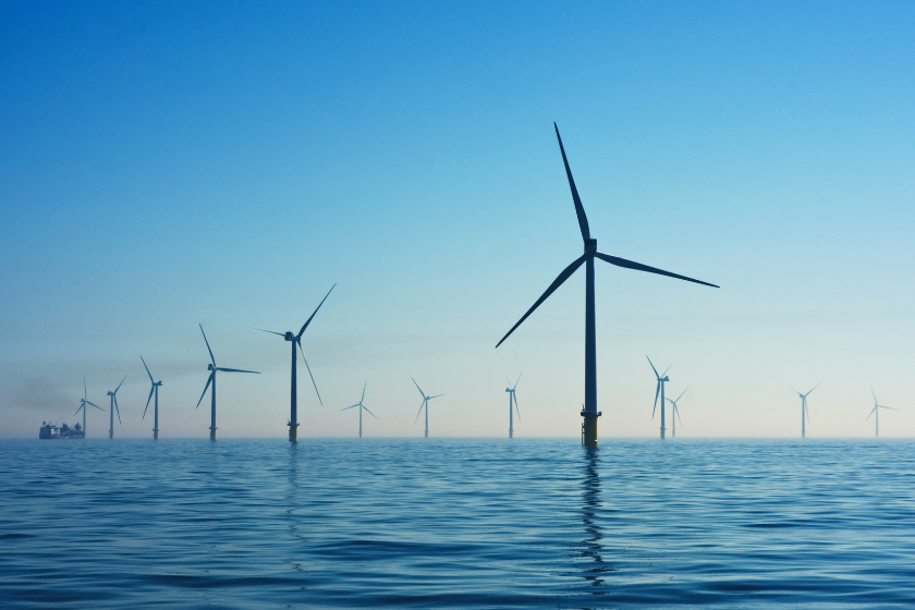 Row of wind turbines in the ocean