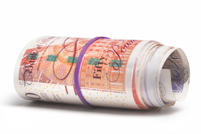 Rolled up UK bank notes