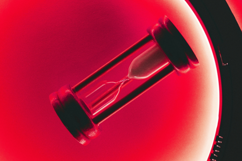 Image of a sand timer with a red background